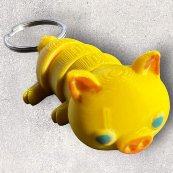 Jucărie keychain porcușor Galben, material moale și durabil pentru copii și colecție de accesorii.